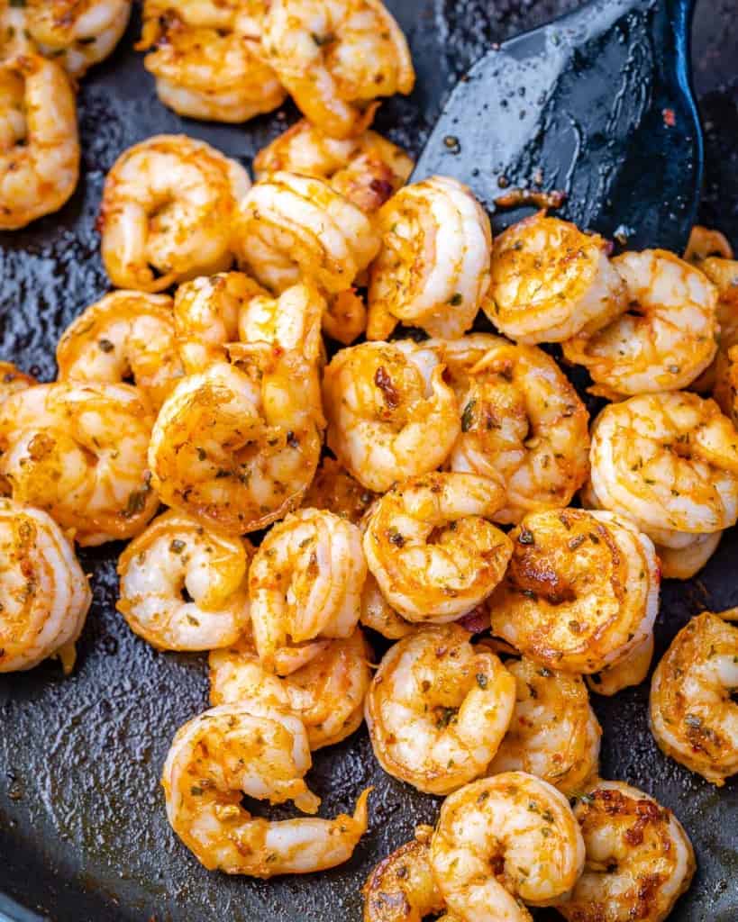 sauteed shrimp in a black skillet for risotto 
