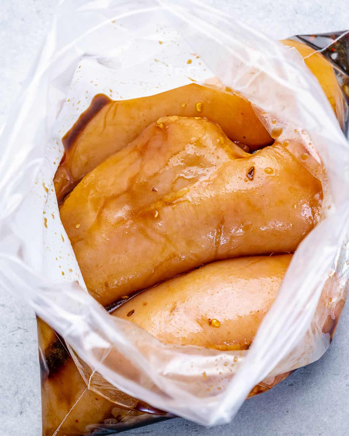 chicken breasts in bag with marinade