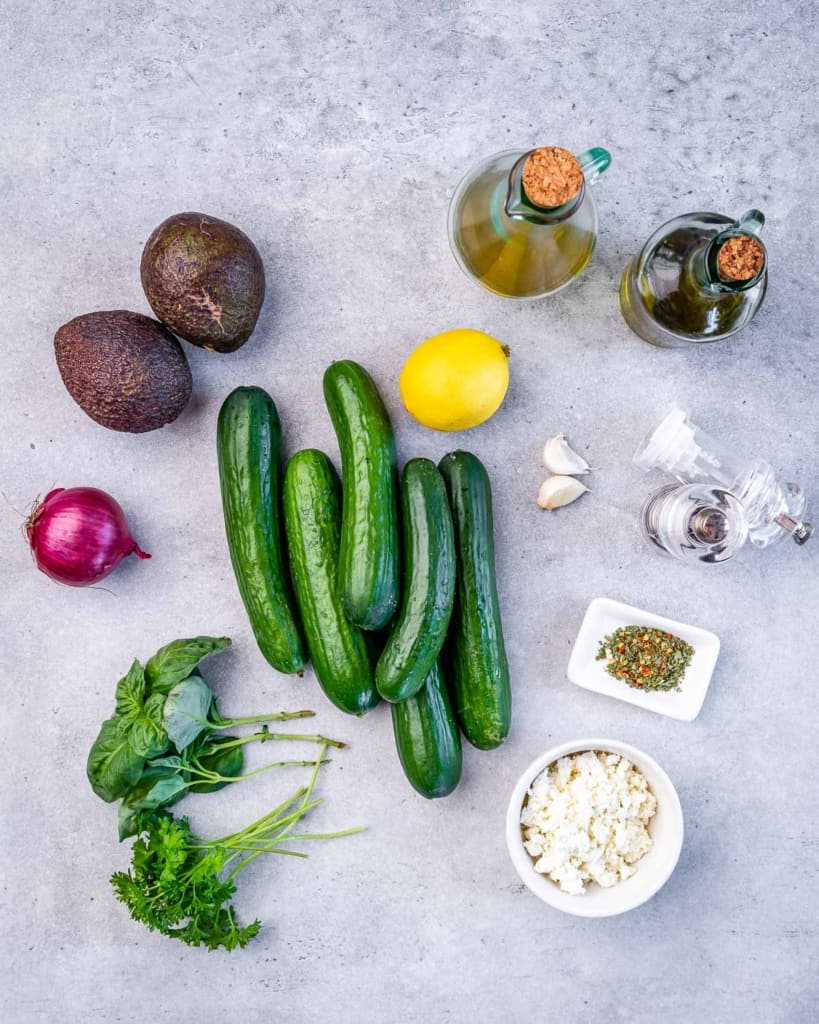 ingredients laid out to make the cucumber avocado feta salad 