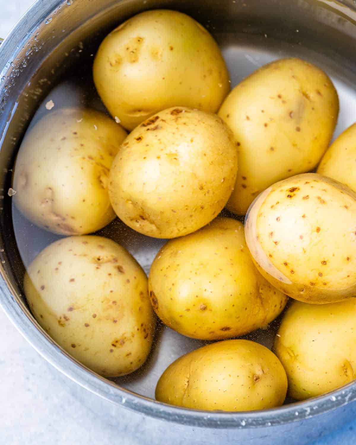 bowl of potatoes in water