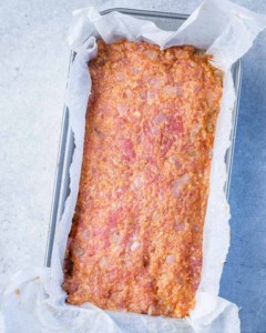 meatload mixture added to meatloaf pan before baking