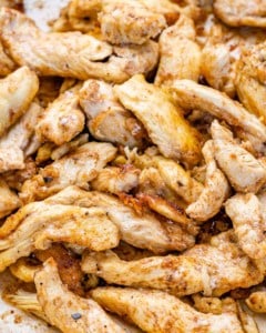 cooked chicken strips in a skillet for chicken fajita.