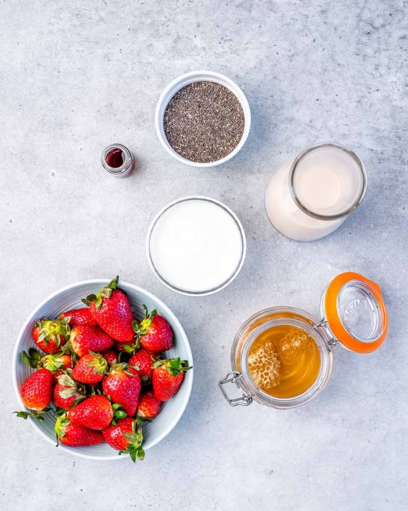 ingredients to make chia seed pudding with fresh strawberries