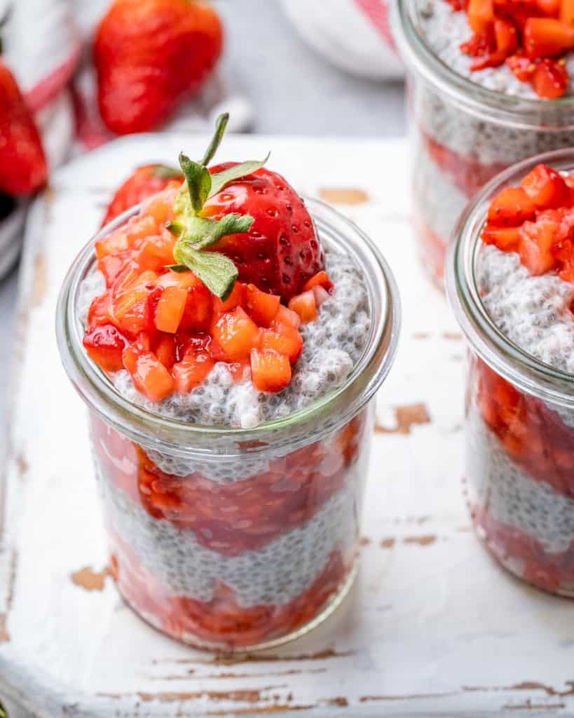 top view chia seed pudding in a jar topped with strawberries 