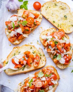 top view of tomato mixture added over bread
