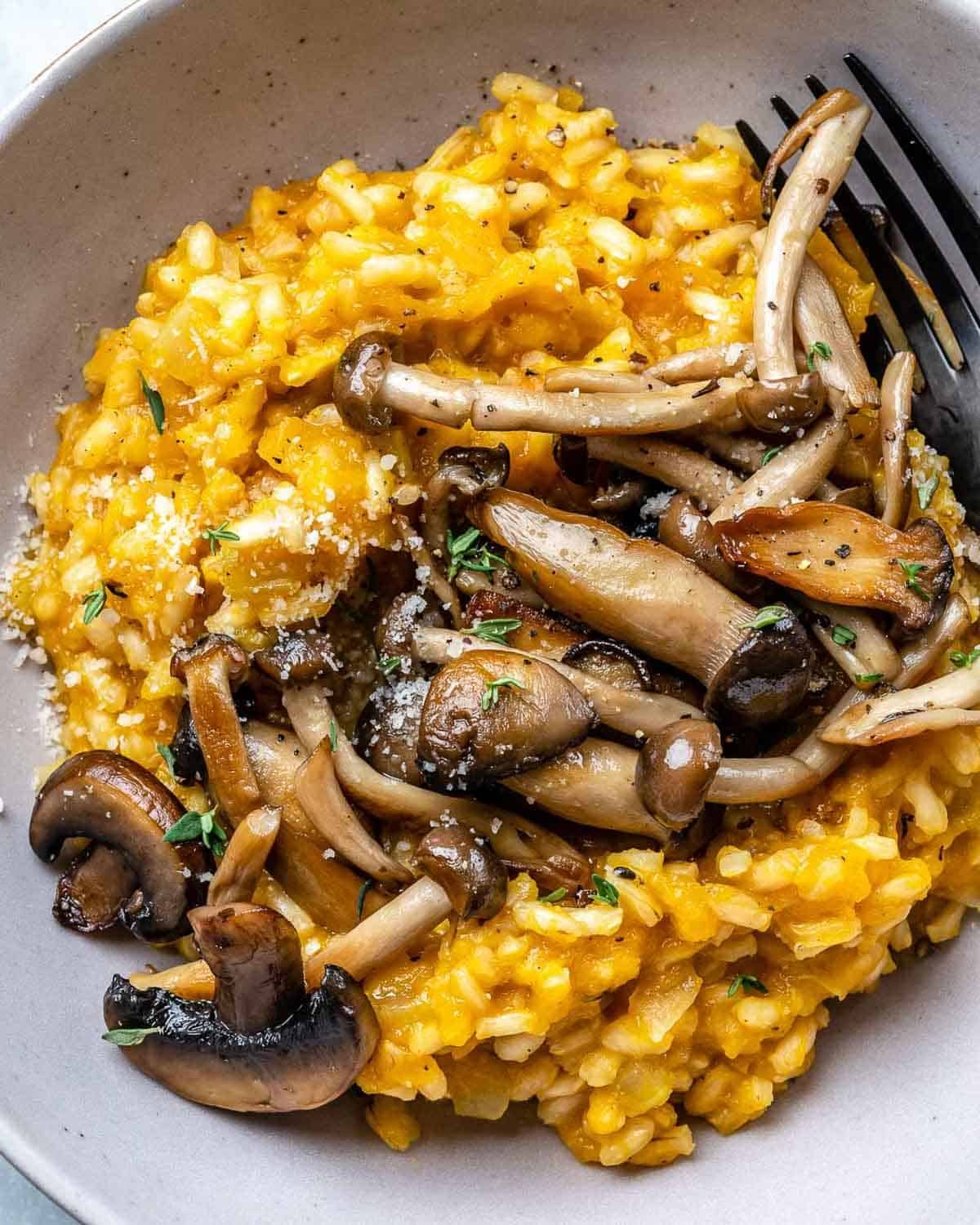 risotto made with butternut squash and topped with sauteed mushrooms.