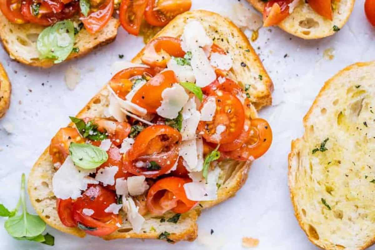 a single tomato bruschetta on a flat surface.