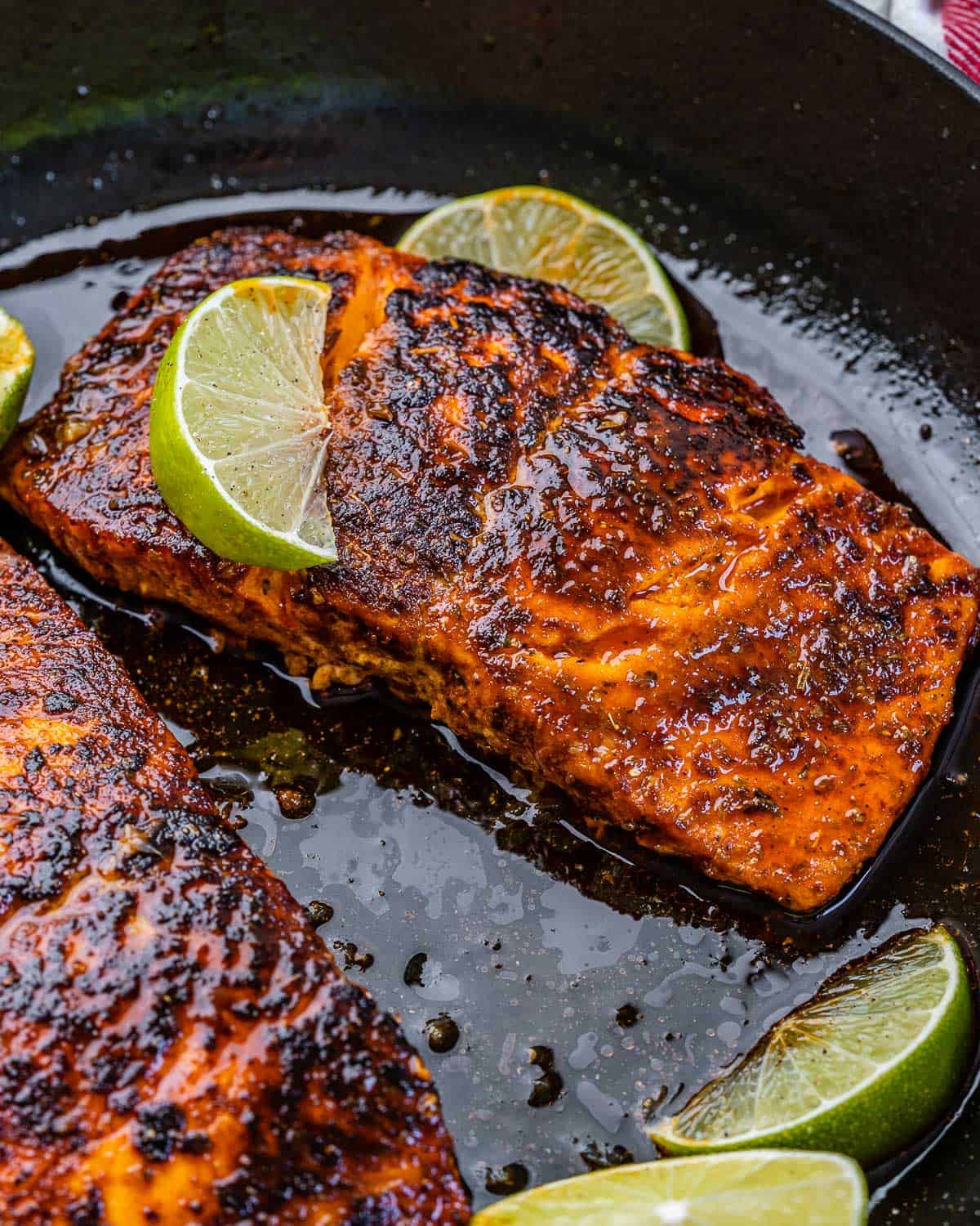 close up of salmon fillets in skillet
