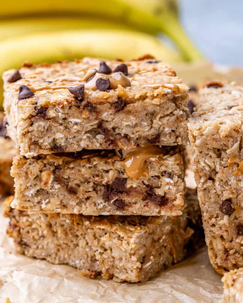 side shot image of 3 oatmeal bar squares stacked on each other 