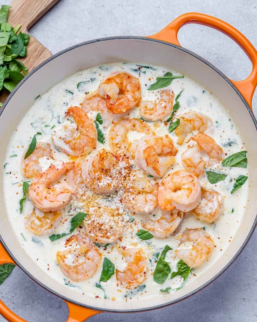top view sauteed shrimp in a creamy garlic spinach sauce 