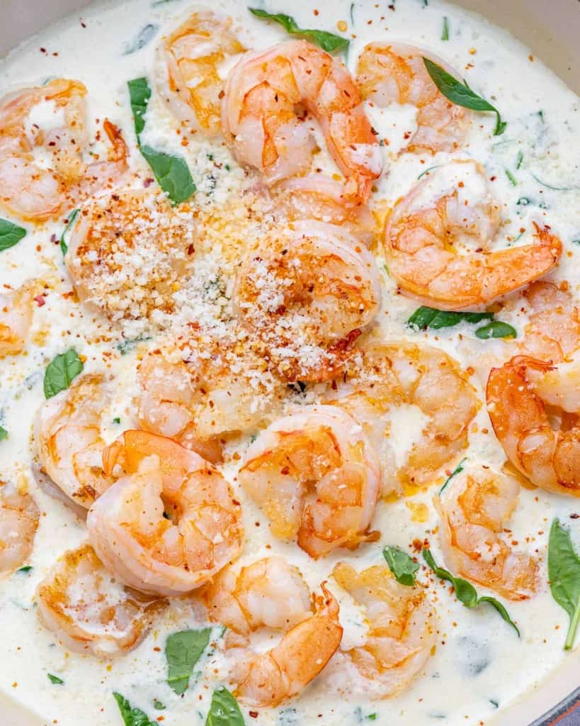 top view of sauteed shrimp in a creamy garlic sauce. 