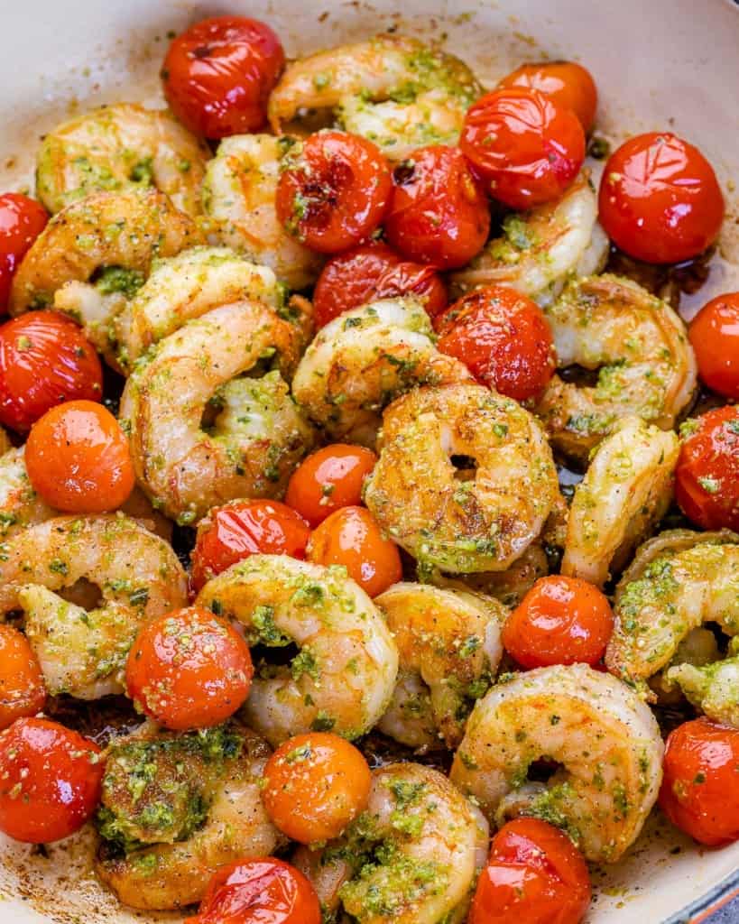 close up pesto shrimp and tomatoes 