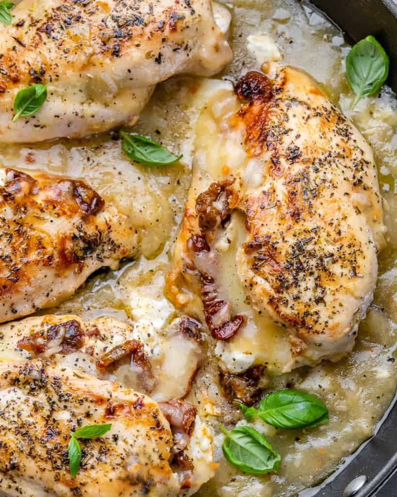top view close up image of stuffed chicken breasts in a skillet
