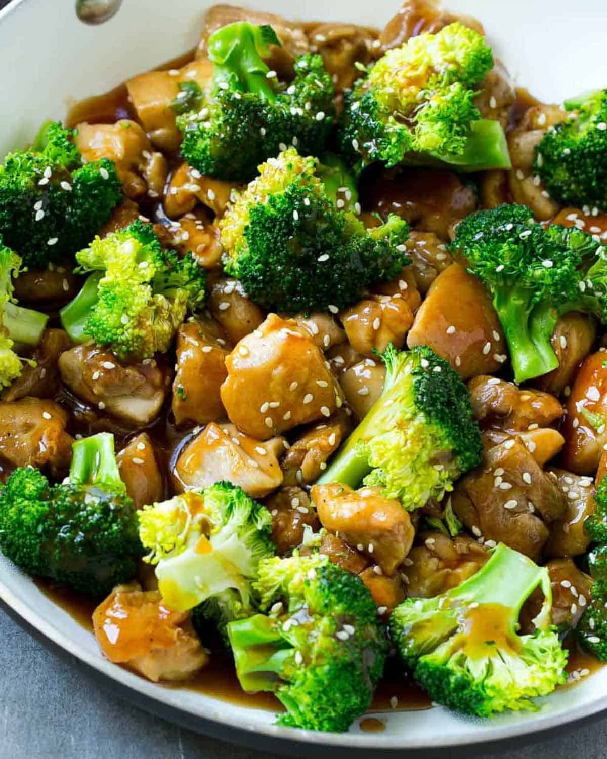 Easy Chicken and Broccoli Stir Fry chicken and broccoli stir fried in a skillet in a terriyaki sauce.