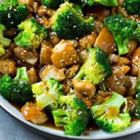 chicken and broccoli stir-fried in a pan.