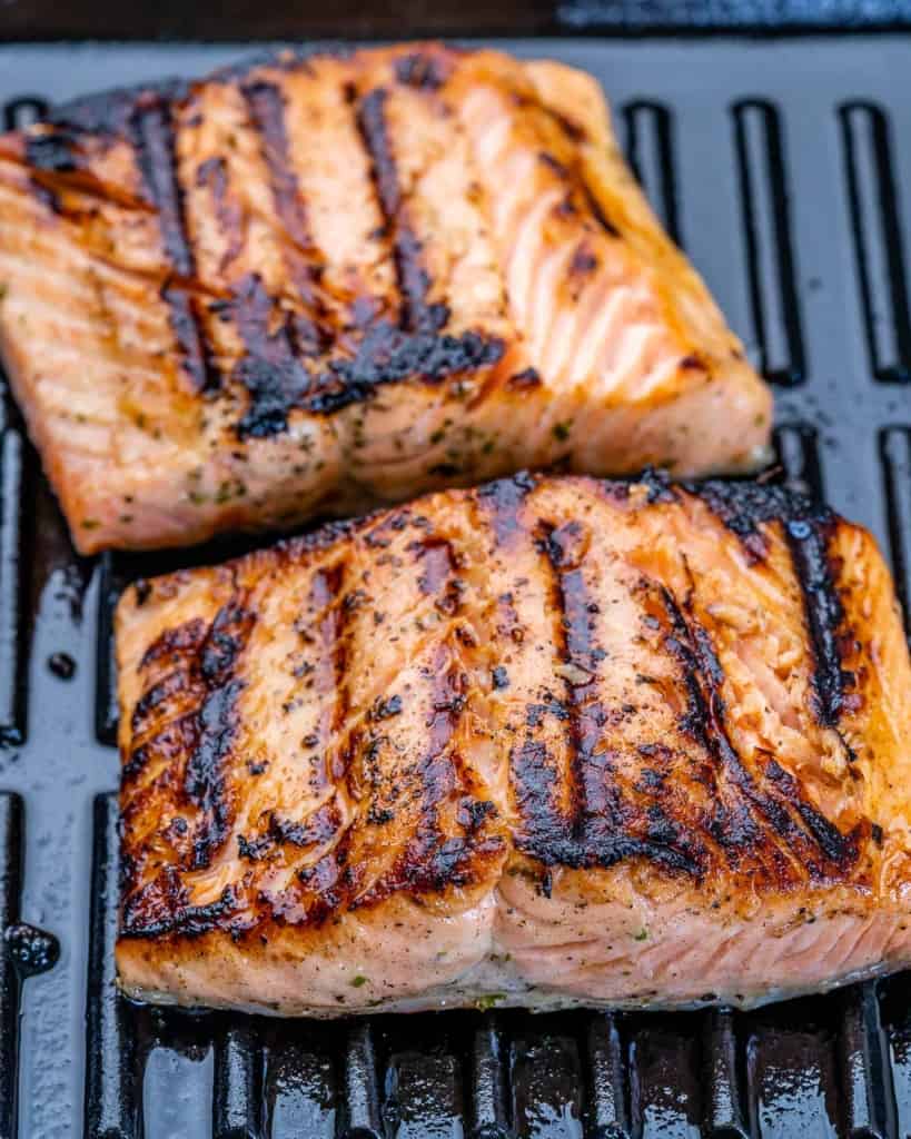 side shot of 2 salmon filets on grill pan