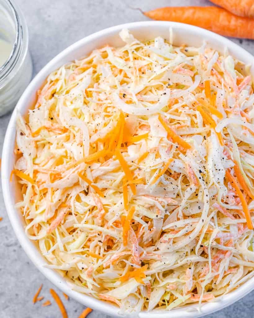 top view close up image of close slaw salad in a white bowl