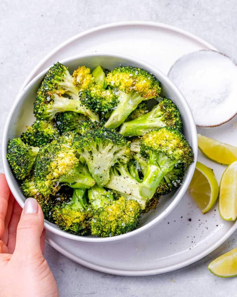 white bowl containing air fried broccoli