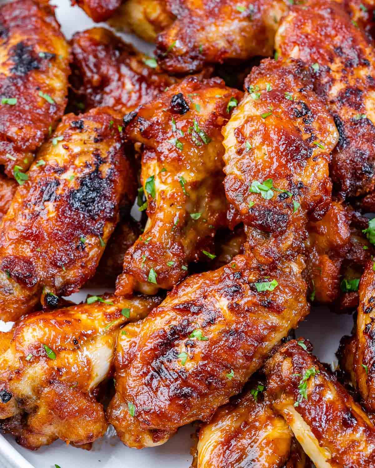 close view of healthy baked chicken wings with parsley