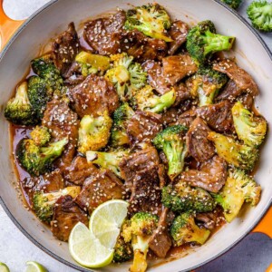 top view beef stir fry with broccoli in an orange skillet
