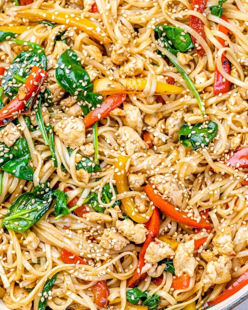 lo mien with chicken and veggies in a skillet