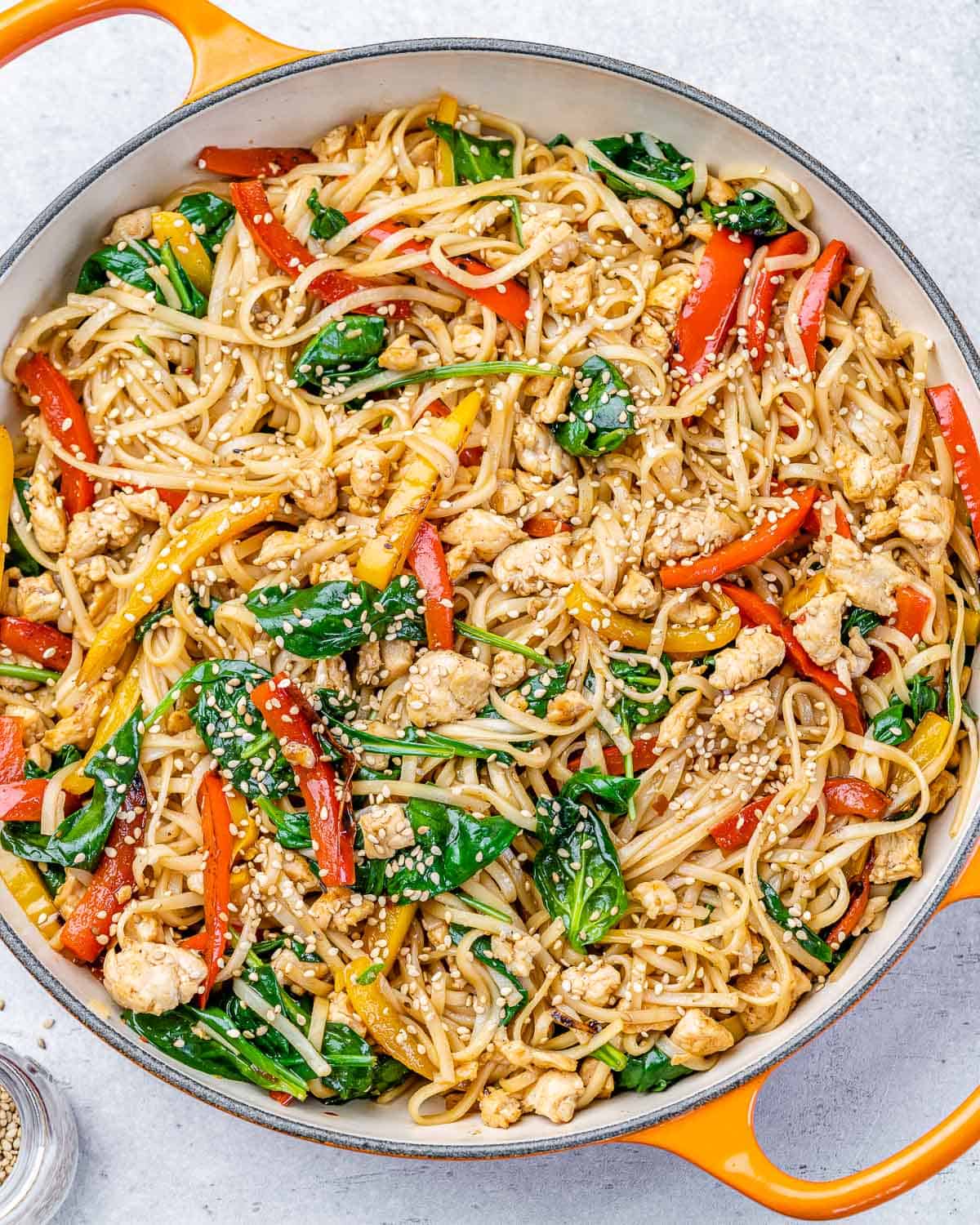 top view of chicken lo mien in an orange skillet