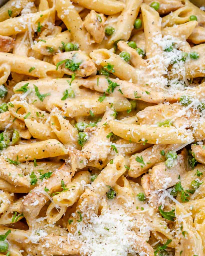 close up chicken pasta with parsley garnishes