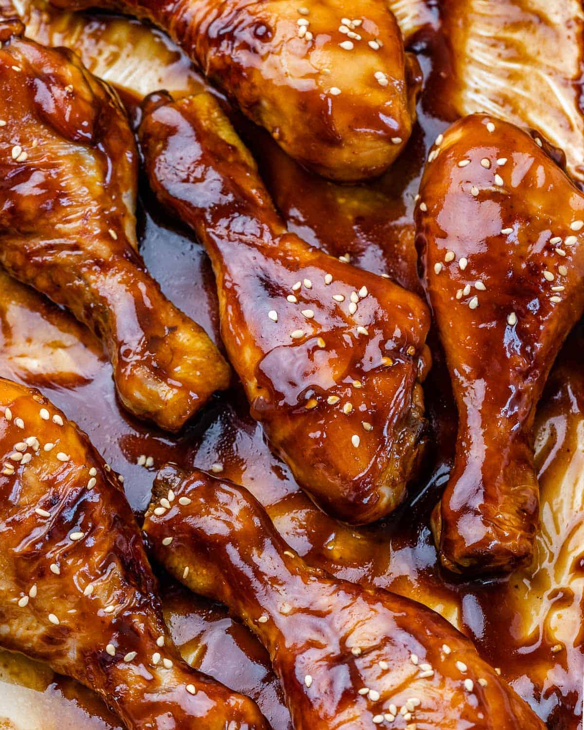 baked honey chicken drumsticks in baking dish. 