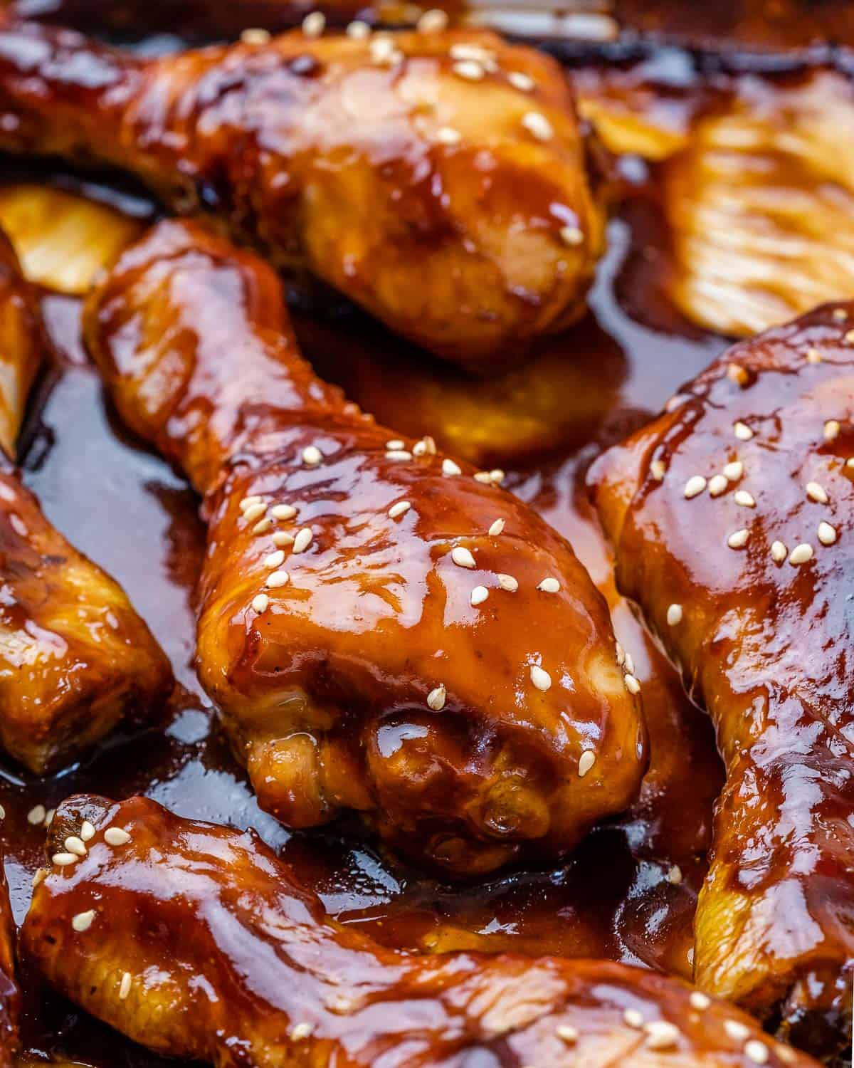 close-up of honey baked drumstick in baking dish. 