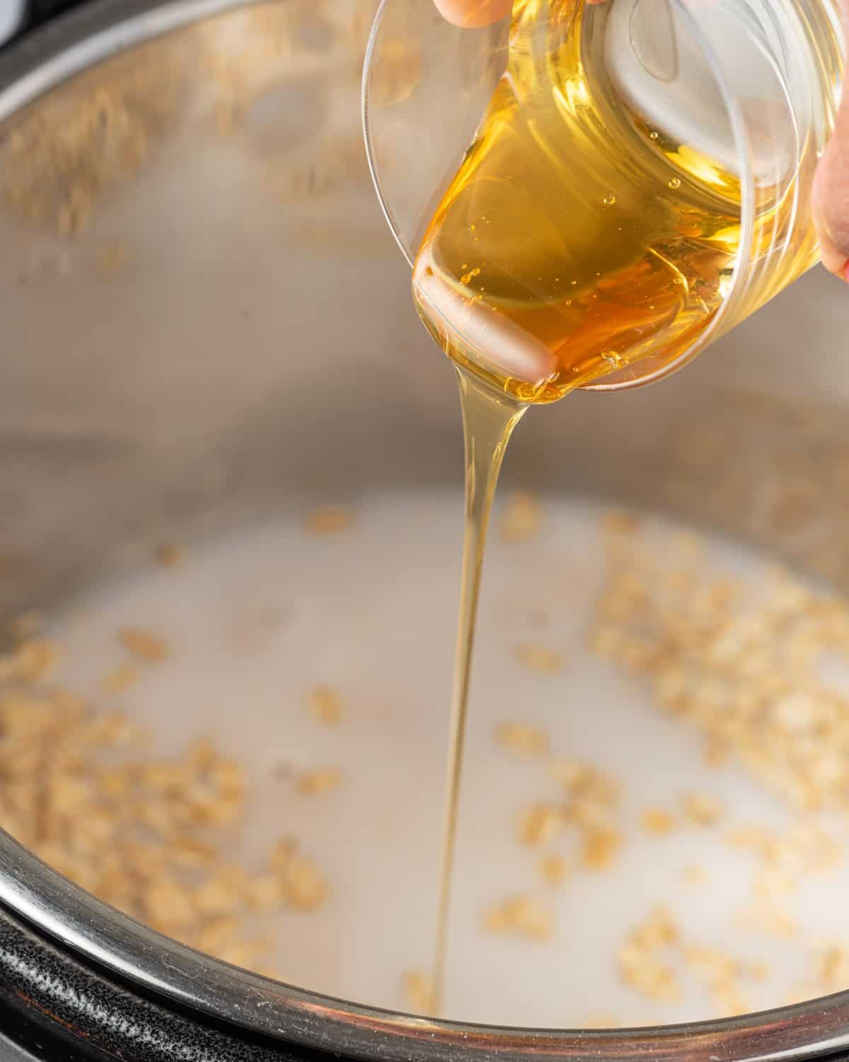 maple syrup being poured in the instant pot