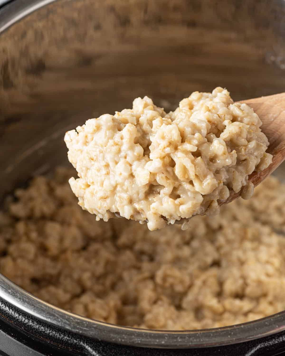 wooden spoon scooping oatmeal from instant pot