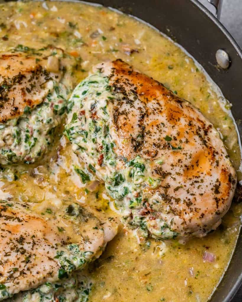 top view and close up image of stuffed chicken breast in a sauce