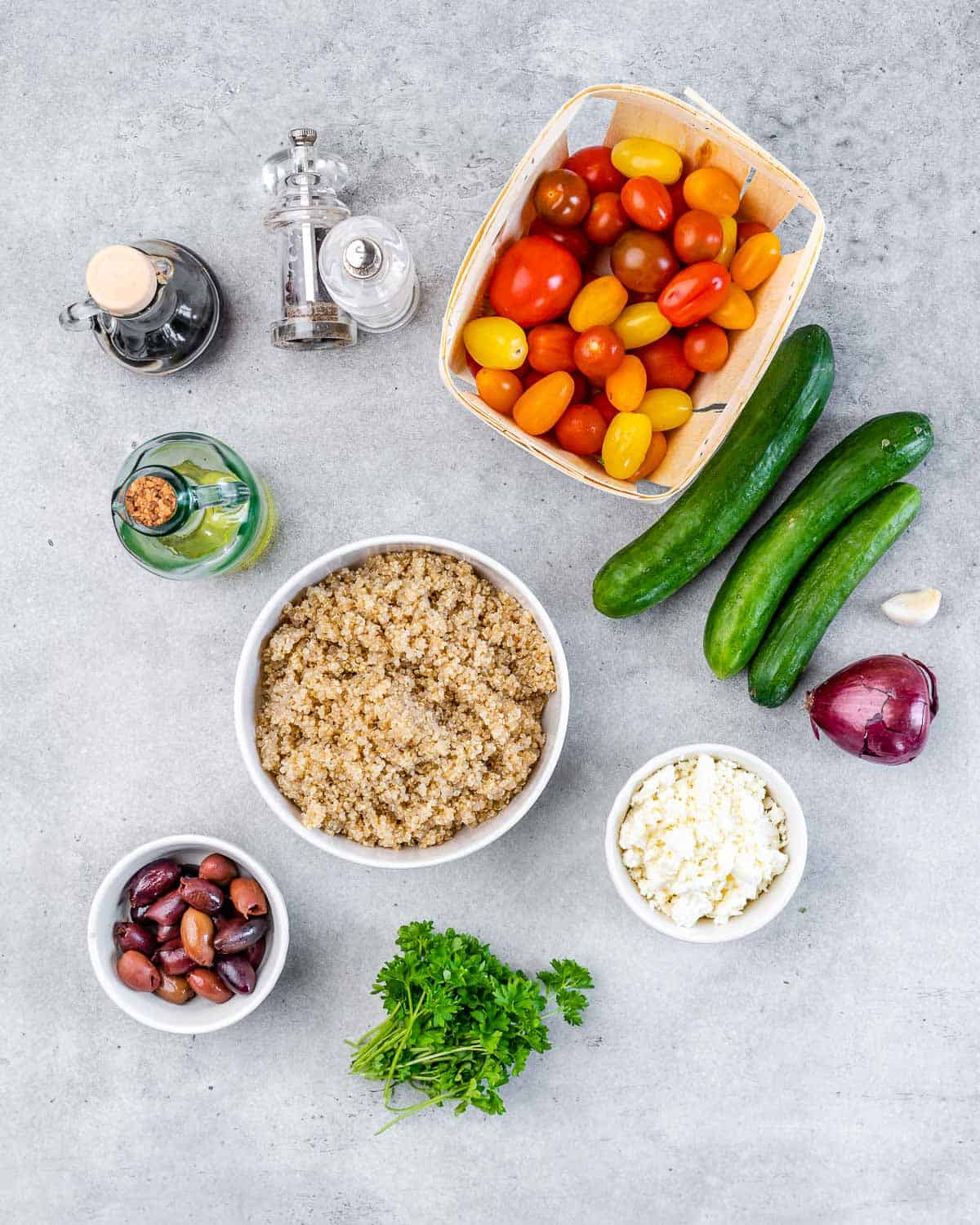 Ingredients for Mediterranean salad on a white table. 