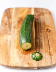 tip of zucchini cut off on a cutting board
