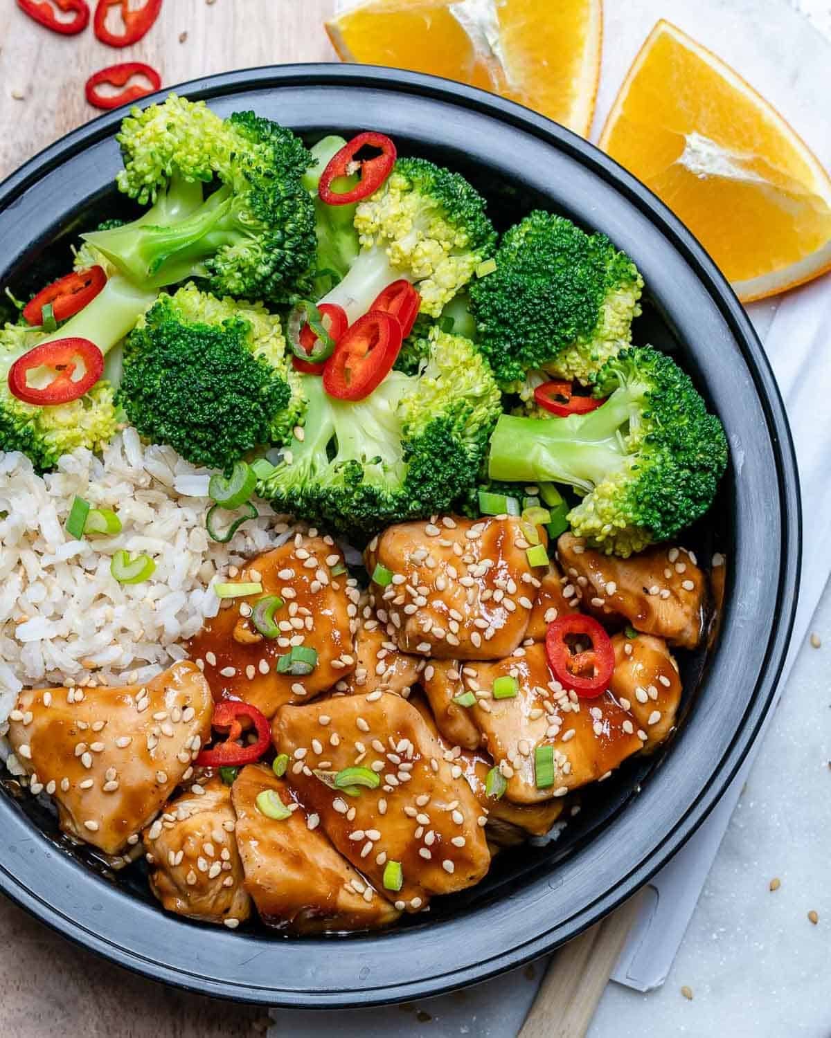 teriyaki chicken bites served with broccoli and rice in a meal prep bowl.
