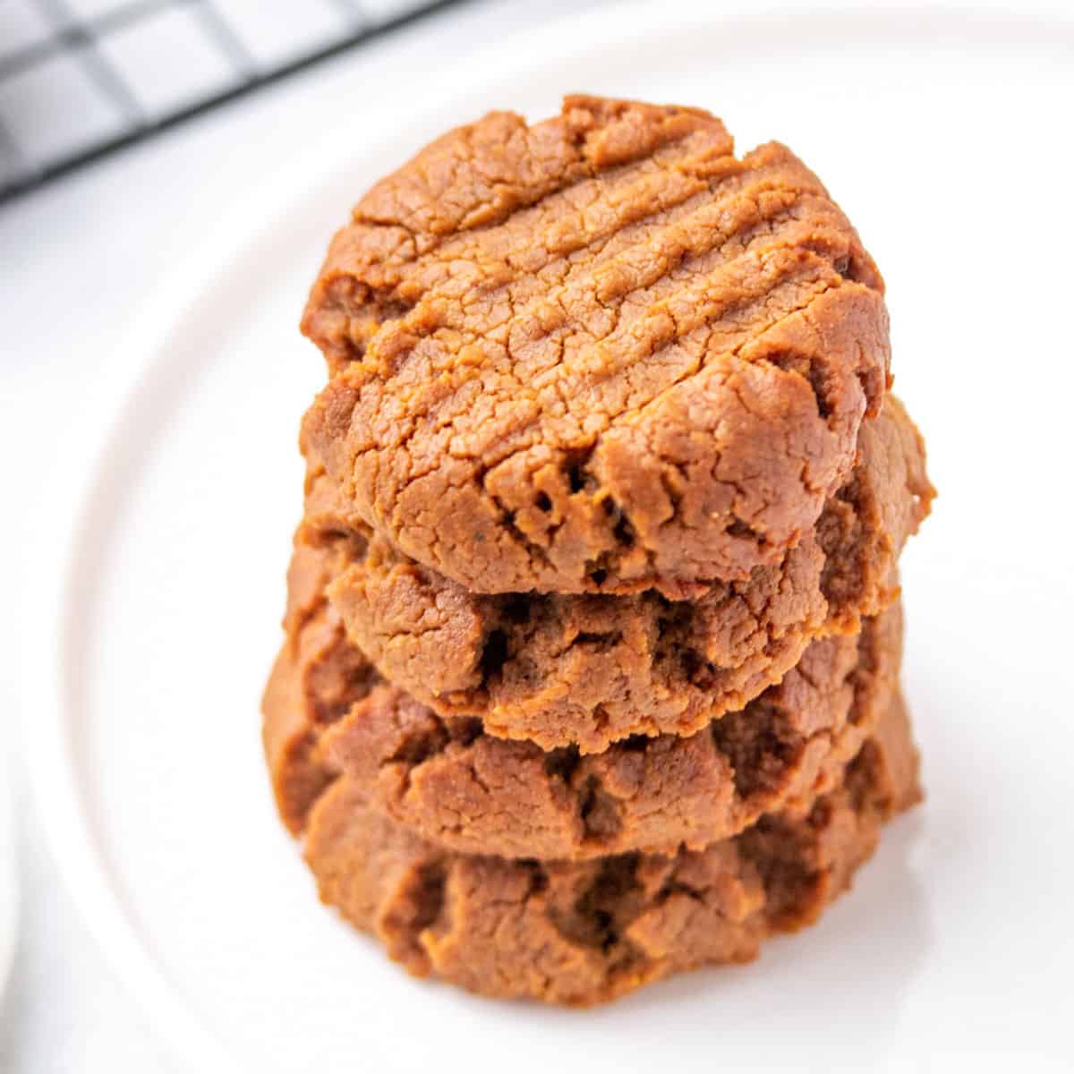 4 peanut butter cookies stacked over each other
