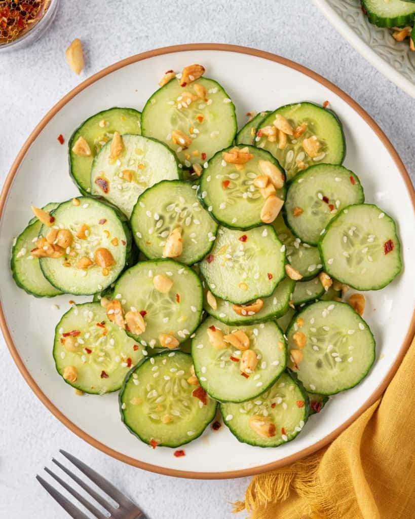 top view of cucumber salad in a white plate 
