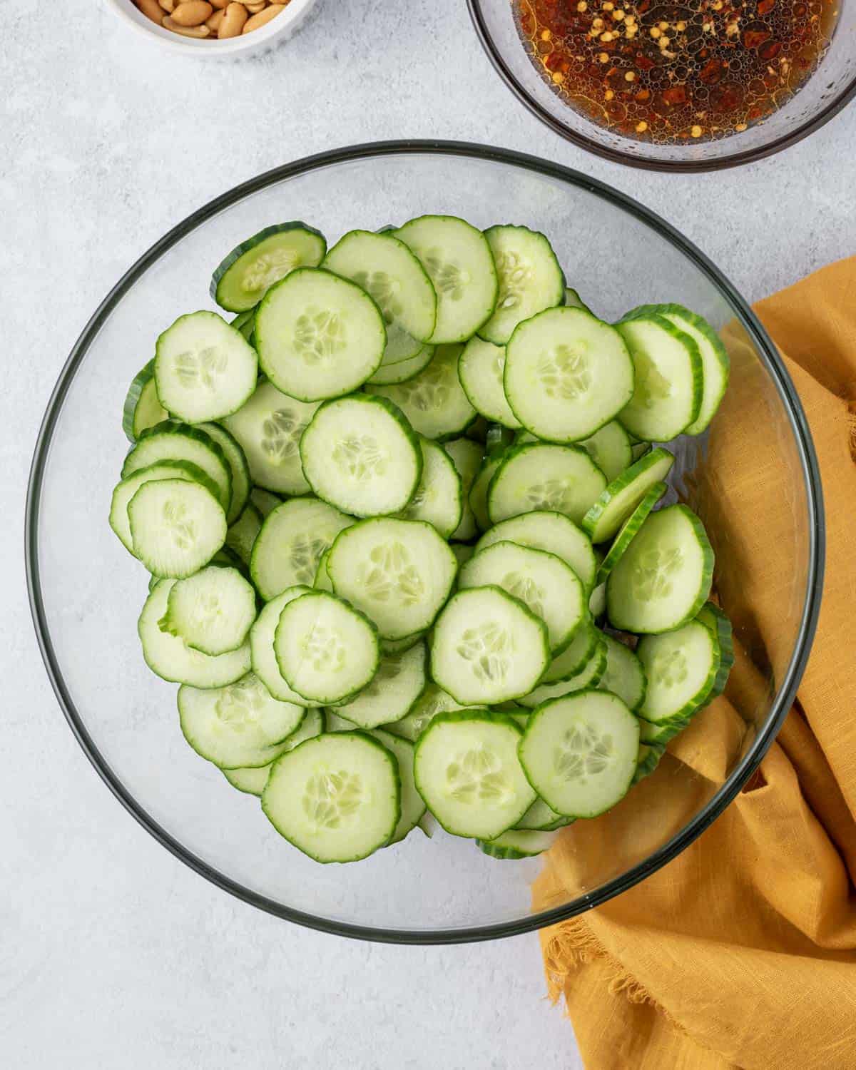 sliced cucumber in a clear bowl.