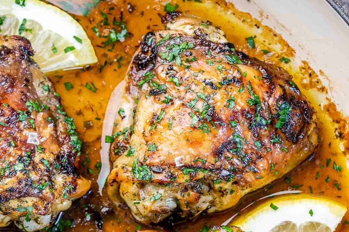top view of chicken thighs with lemon and parsley