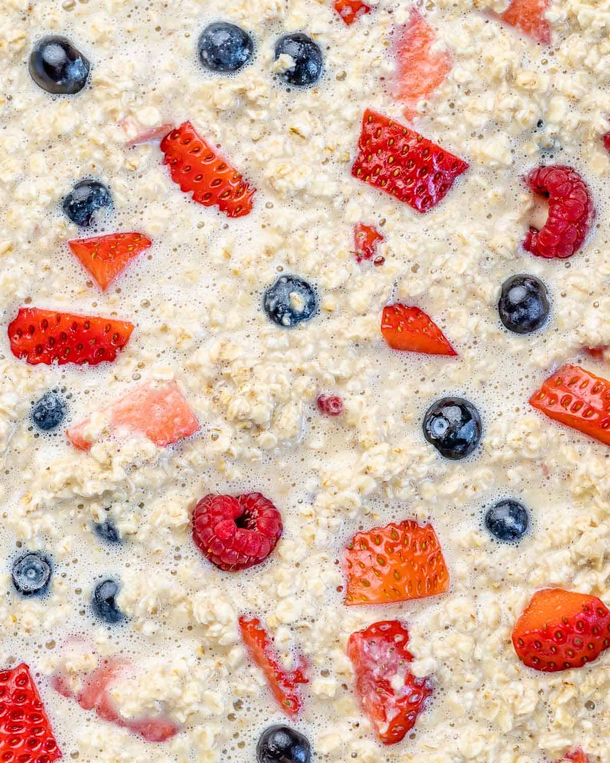 raw oatmeal mixture with berries before baking