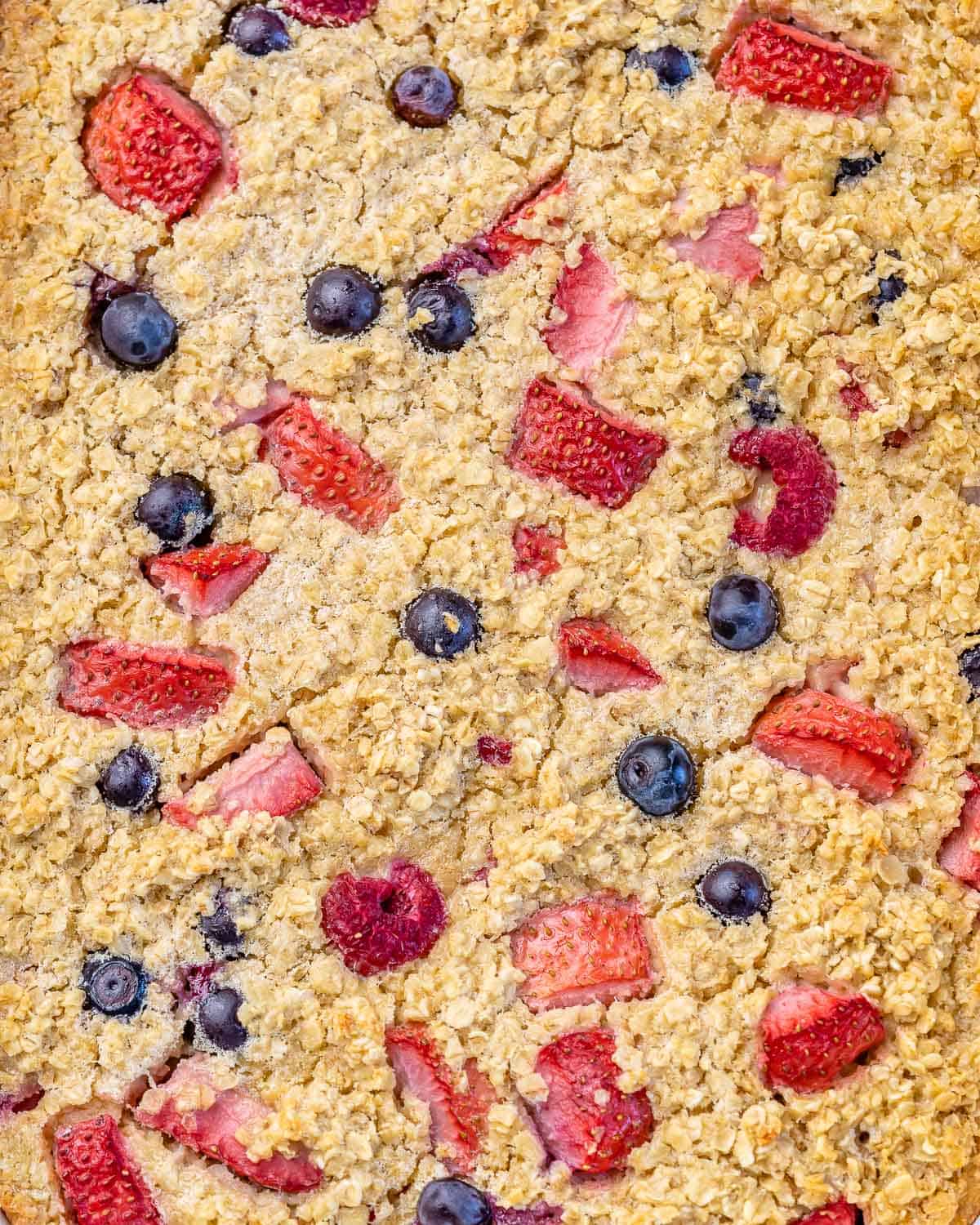 baked oatmeal with berries still in pan before slicing