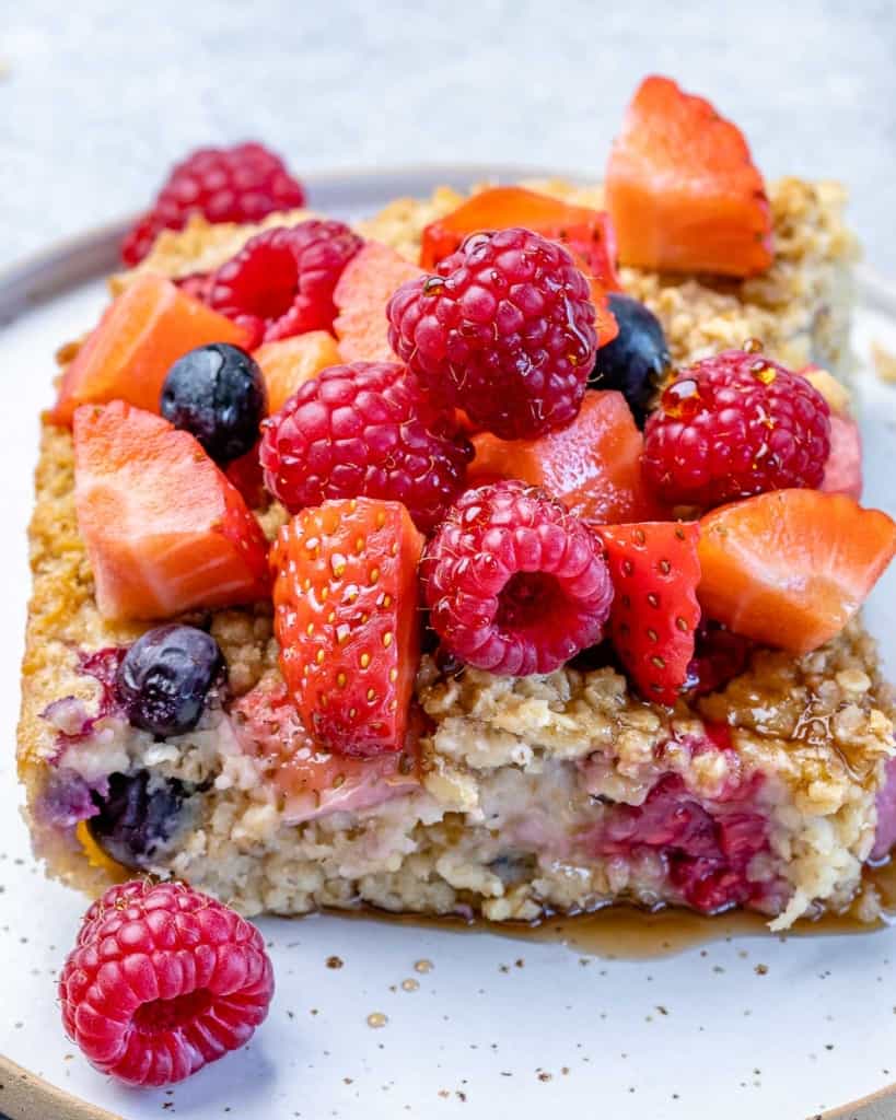 side shot of a slice of oatmeal bake with berries 