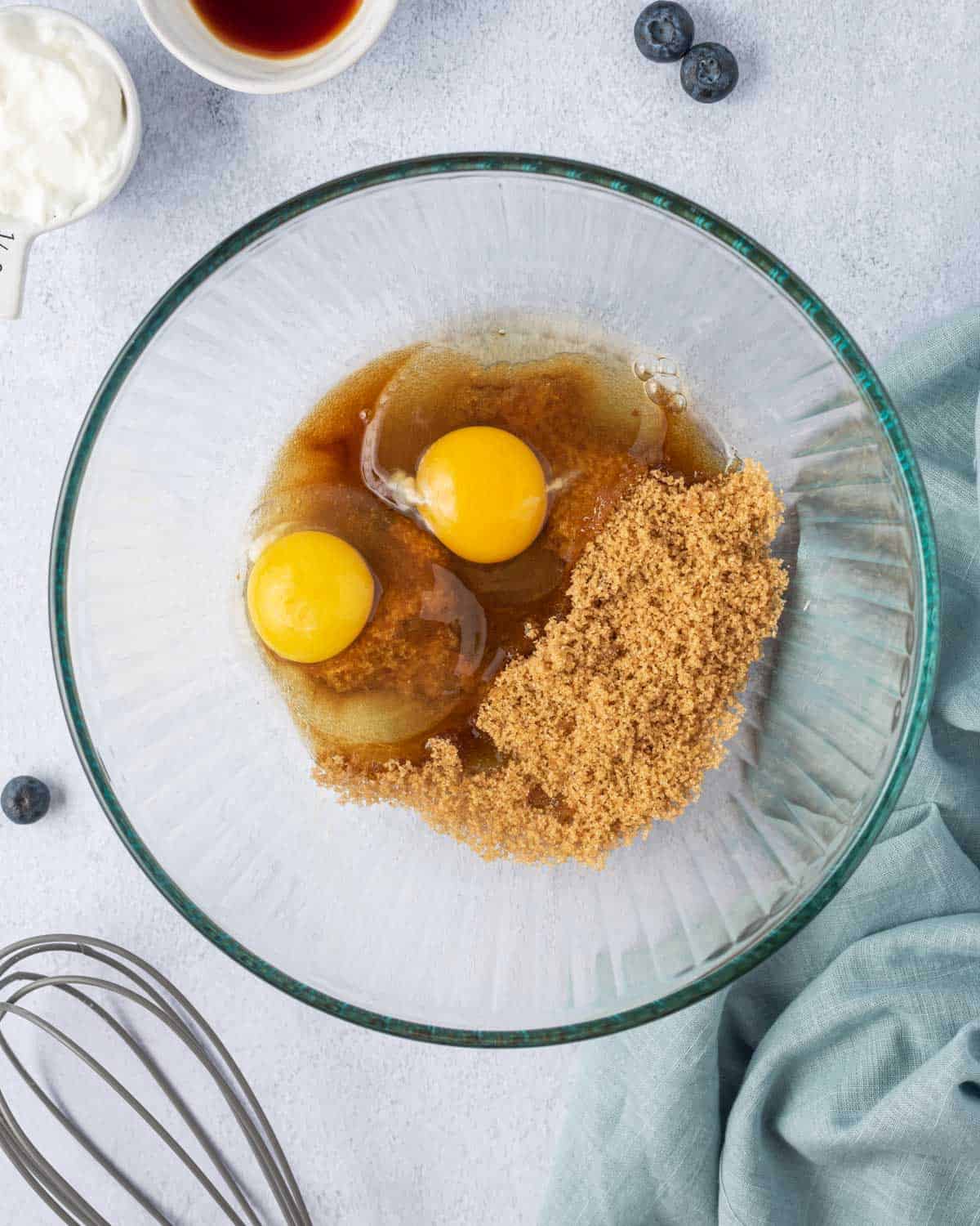 brown sugar, eggs, and coconut oil, placed in a bowl