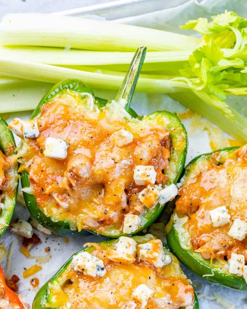 top view of stuffed green bell peppers with melted cheese