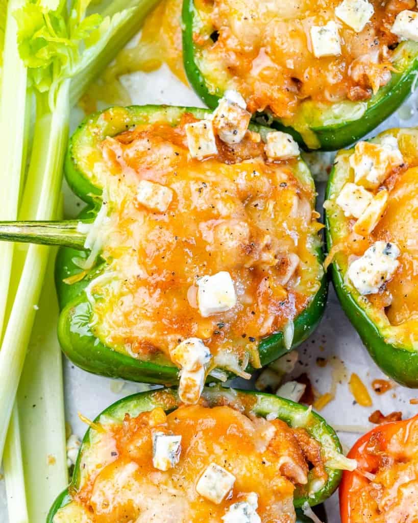 close up  stuffed green pepper topped with melted cheese