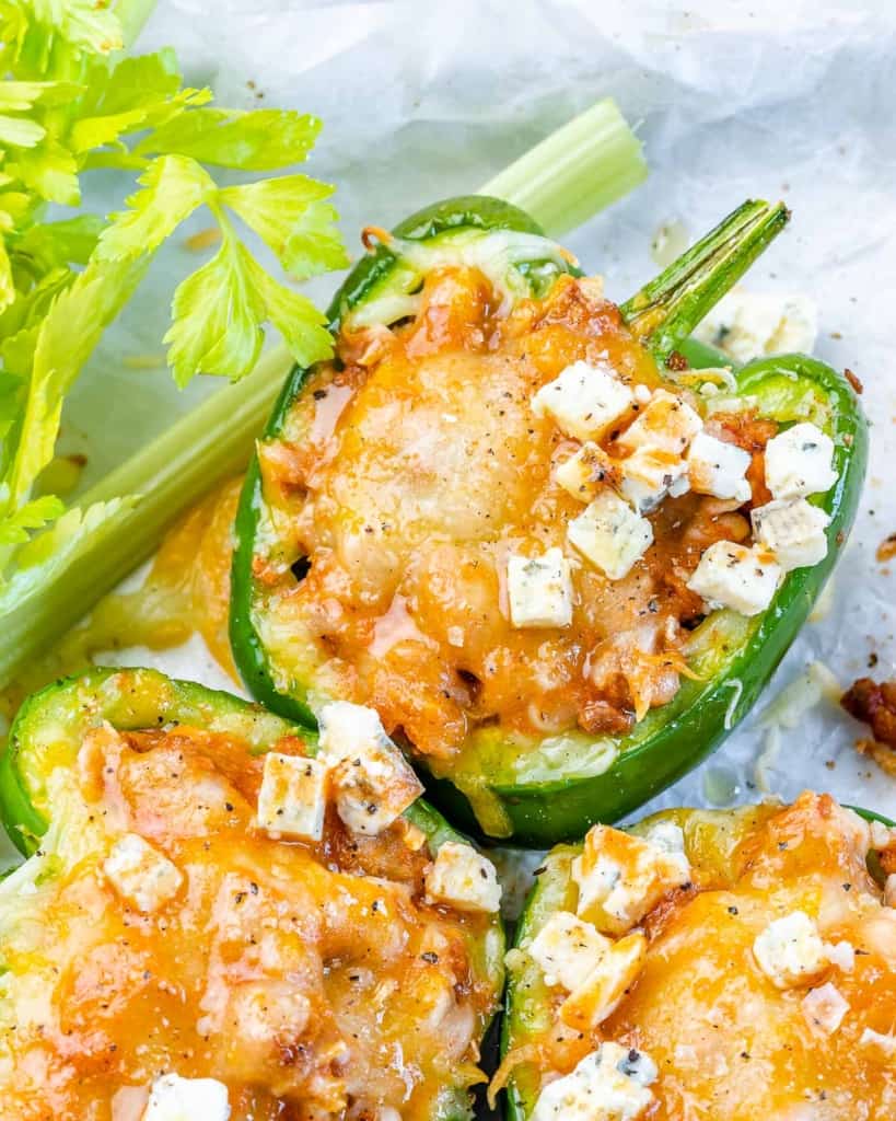 close up image of stuffed peppers topped with cheese