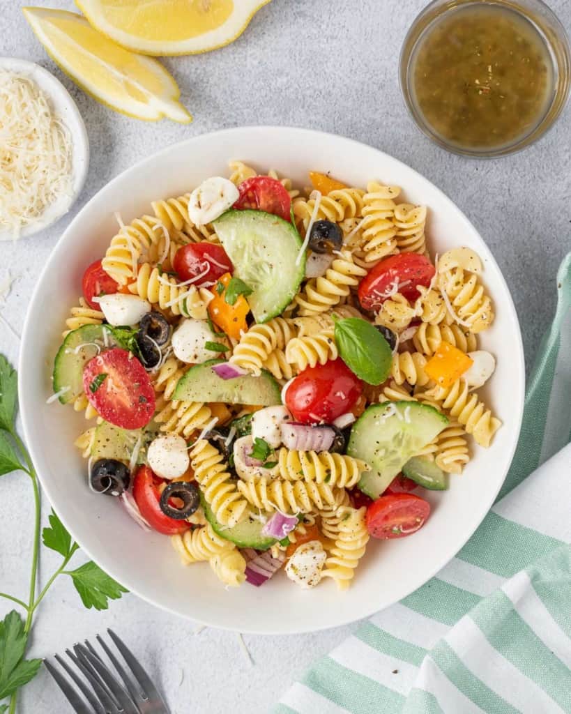 pasta salad in a round white plate 
