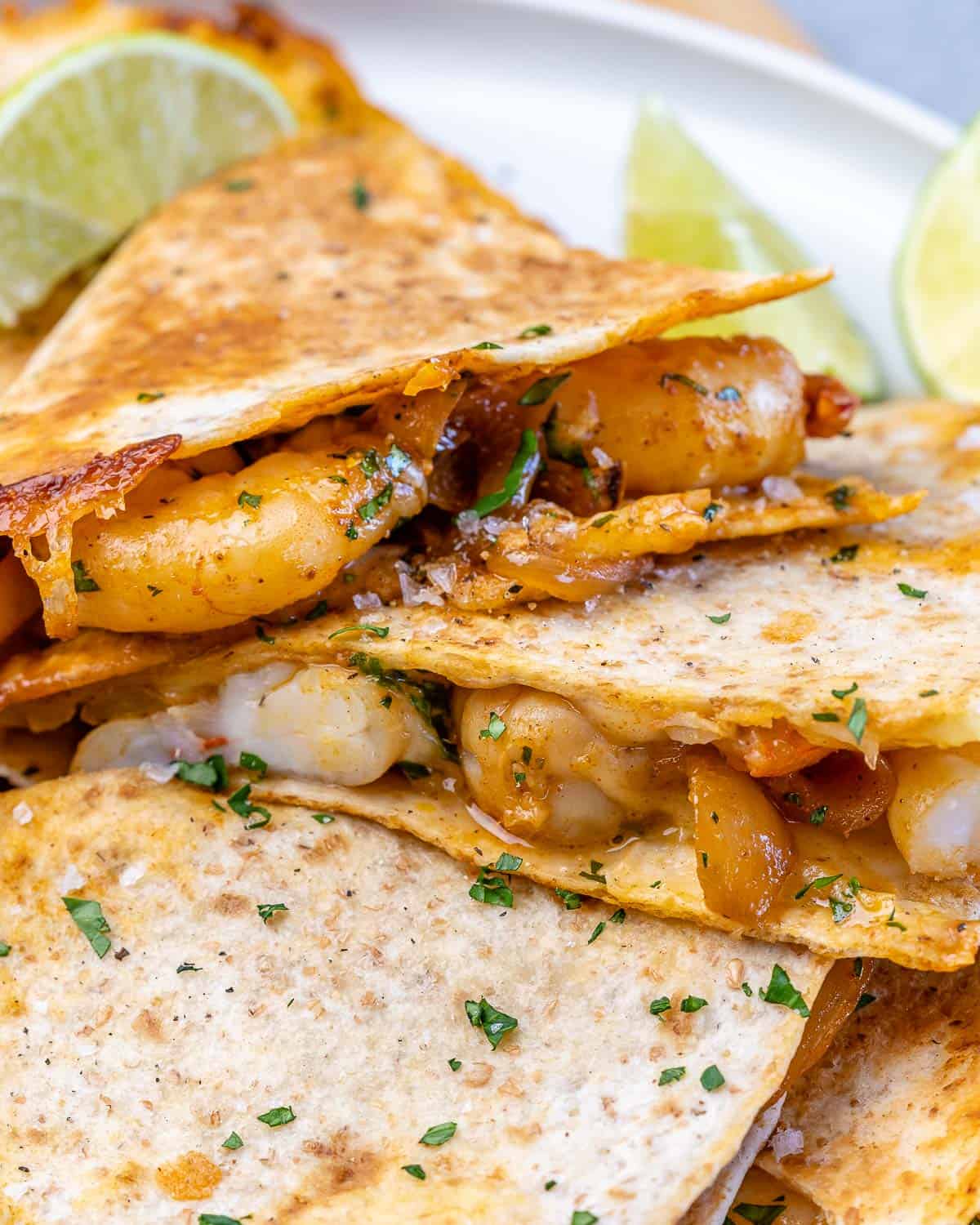 close view of wedges of shrimp quesadilla recipe with cheese