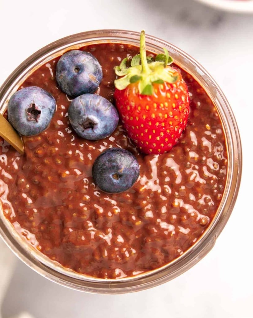 top view chia pudding in a jar topped with berries 