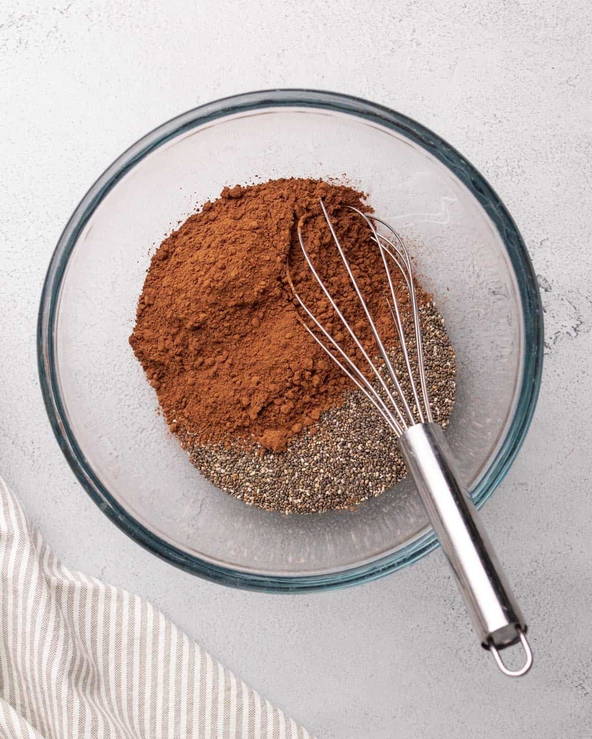 cocoa powder poured over chia seeds
